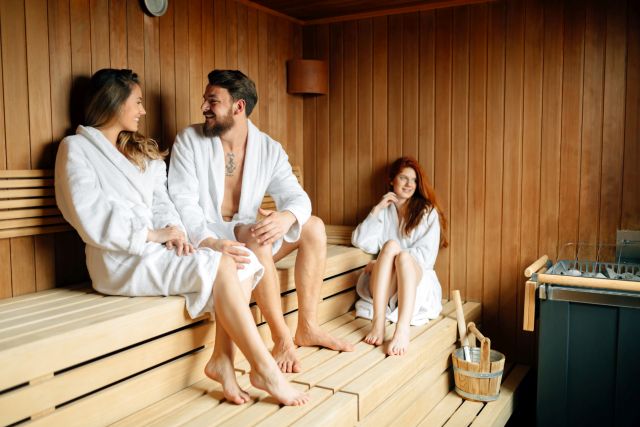 People relaxing in sauna