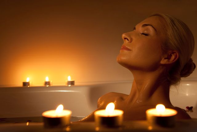 Lovely young woman relaxing in bathroom
